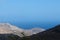 Greece, the island of Sikinos. A view from the hills to the blue sea.