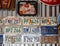 Greece, June 2020:  A collection of car license plates from different States and pin up style pictures in a biker cafe in Greece