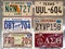 Greece, June 2020:  A collection of car license plates from different States and pin up style pictures in a biker cafe in Greece