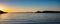 Greece, Kea island, sunset. Seascape with lighthouse, clear blue sky and calm sea background, banner