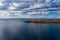 Greece, Kea Tzia island. Lighthouse on rocky cape, sky, sea background