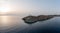 Greece, Kea Tzia island. Lighthouse on rocky cape, sky, sea background