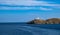 Greece, Kea Tzia island. Seascape with lighthouse, clear blue sky