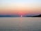Greece, Loutraki, the hot sun slowly sinks into the warm waters