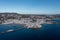 Greece, Mikonos island, Cyclades. Aerial drone view. Mikonos Chora whitewashed buildings cityscape, port and coastline