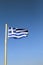 Greece, the national flag. Blue skys, the flag fluttering in the wind