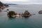 Greece Parga. Aerial drone view of Panagia island, small chapel and trees on the rock