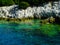 Greece rocky coasline, green, blue, turqouise, aquamarine water, mediterranean sea.