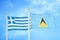 Greece and Saint Lucia two flags on flagpoles and blue sky