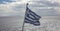 Greece sign symbol of leading shipping power in world. Greek waving flag on pole over sparkle sea