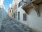 Greece Tinos island, Chora town, Cyclades. Whitewashed houses, cobblestone alleys, blue sky