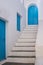 Greece. Traditional architecture in white and blue. Greek island building and stair, door and window