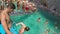 GREECE, ZAKYNTHOS AUGUST 2017: Kids and adults tourists swimming in the sea of Zakynthos island Greece
