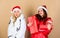Greedy santa girl. Girls wear winter jackets beige background. Buy gifts. Shopping day. Fashion trend. Winter season