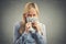 Greedy young woman, holding tight dollar banknotes