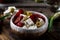 Greek cheese feta with herbs and olives, sundried tomatoes. Bulgarian cheese. Feta in oil. Olove oil. selective focus