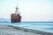 Greek coastline with the famous rusty shipwreck in Glyfada beach near Gytheio, Gythio Laconia Peloponnese.