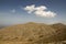 Greek Crete mountain range with highest mountain Ida Psiloritis, very dry hard terrain with sharp rocks and stones, white clouds