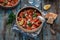 Greek cuisine shrimps saganaki with tomato sauce and feta cheese, copy space