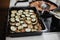 Greek dish in a baking tray standing on the stove