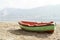Greek fishing open deck motor boat docked on Telendos island sandy coastline