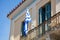 Greek flag on a balcony of a neoclassical house, Ahens, Plaka