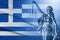 Greek flag and figure of Justice in full frame