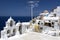 Greek flag and four bells in Oia, Santorini, Greece