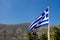 Greek flag and the mountains of Crete