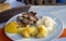 Greek grilled pork with rice and potatoes