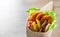 Greek gyros with fried squid rings breaded, tzatziki sauce, vegetables