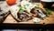 Greek Gyros with tzatziki sauce, open layout on a wooden board