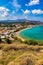 Greek holidays, beautiful Kalyves village with turquoise sea in Crete island, Greece. View of Kalyves beach, Crete. Tourists