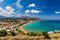 Greek holidays, beautiful Kalyves village with turquoise sea in Crete island, Greece. View of Kalyves beach, Crete. Tourists