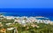 Greek holidays - beautifulcity of Hersonissos, view from the top of mountain with turquoise sea. Crete island