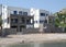 Greek Homes with Blue Window Shutters by The Beach in Chios