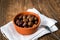 Greek Kalamata black red olives in a clay bowl