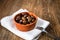 Greek Kalamata black red olives in a clay bowl