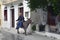 Greek man on donkey in the picturesque town of Plomari