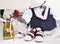 Greek Orthodox christening objects - baby clothes, shoes, baptism oil, soap and candles