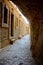 Greek Orthodox monastery in a rock on mountain of temptations. Pilgrimage to the Holy Land, vertical photo of a corridor of caves