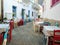 Greek outdoors tavern restaurant at Batsi village, Andros island Cyclades Greece