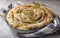 Greek pie spanakopita  over concrete  background. Ideas and recipes for vegetarian or vegan  Spinach Pie from fillo pastry cut in