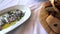 Greek Potato salad and fish Gavros with bread with olive oil, camera panning.