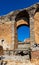 Greek and Roman Teatro antico Ancient Theatre with stage and arches colonnade ruins in Taormina of Sicily in Italy