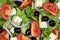 Greek salad background with tomatoes, Feta cheese and olives