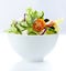 Greek salad with feta in a white bowl