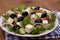 Greek salad with gigantic black olives, sheeps cheese