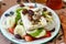 Greek salad with tomato, onion, cucumber, sweet paprika, feta cheese , oregano, vinigar, olive oil and olives.