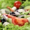 Greek salad with tomatoes, cheese and olives close up